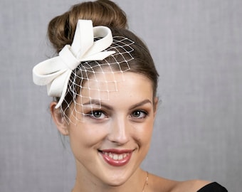 Natural white (light ivory) minimalist small bow fascinator with face veil or without.