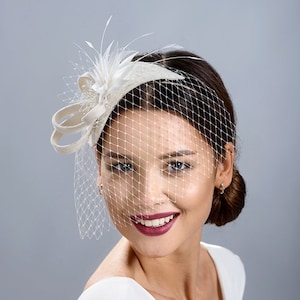 Bridal fascinator with face veil