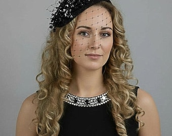Black fascinator hat with veil. Black funeral headpiece.