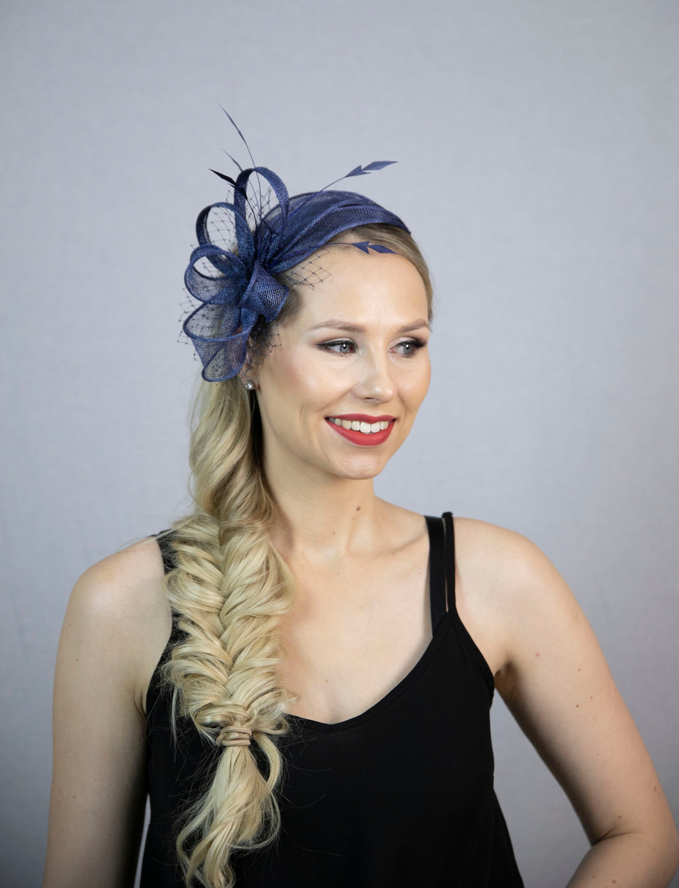 Navy blue fascinator with feathers. Popular design in new colour