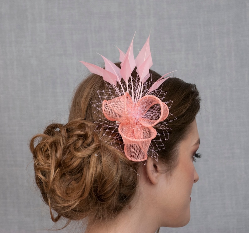Pink feather fascinator. Pink wedding fascinator. Light pink fascinator. Coral pink