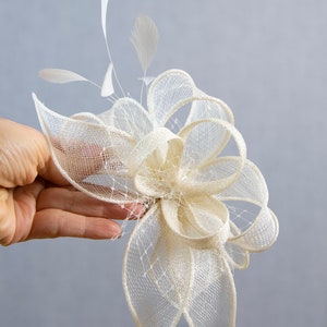 White wedding fascinator with feathers image 10