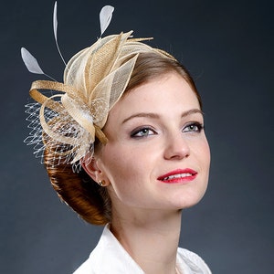Champagne and golden fascinator for your special occasions.