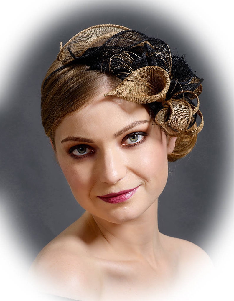 Black and gold luxorious fascinator hat. Made to shops order.