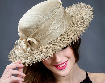 Elegant trendy boater hat in natural colours.