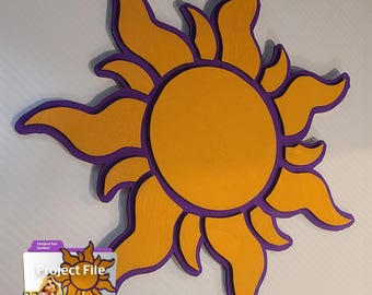 May include: A wooden sunburst decoration in shades of yellow and purple. The sun has a circular center and stylized rays. The image includes a digital file icon with the text "Project File" and the word "Tangled".