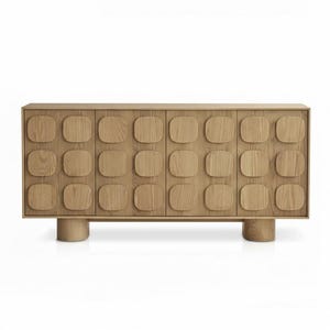 May include: A light-colored wooden cabinet with a rectangular shape and four doors. The doors feature a pattern of rounded square shapes. The cabinet rests on two cylindrical legs, offering a modern and stylish storage solution.