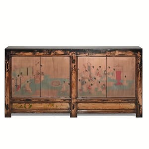 May include: A long rectangular wooden sideboard cabinet featuring a dark brown finish with distressed black edges. The four cabinet doors are decorated with painted scenes of figures in a landscape, and the frame displays intricate carved details.