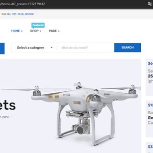 May include: A white drone with four propellers and a camera attached to the bottom. The drone is hovering in the air above a white background. The text "Gadgets" is displayed above the drone, along with the text "The 10 Best Man Collection 2018". The text "$120.00 $295.00" is displayed below the drone, along with the text "BUY NOW".