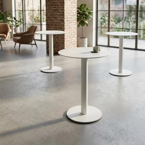 May include: Three white pedestal tables with circular tops and cylindrical bases. Each table features a smooth, matte finish. A small ceramic cup and saucer are placed on the center table. The tables are arranged in an open, spacious area.