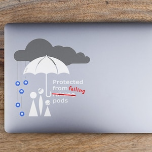 May include: A laptop computer with a sticker of a grey cloud with a white umbrella protecting three stick figures from falling rain pods. The text "Protected from falling rain pods" is written below the umbrella.