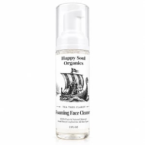 May include: A clear plastic bottle of Happy Soul Organics Tea Tree Clarify Foaming Face Cleanser with a white pump dispenser. The label features a black and white illustration of a Viking ship and text stating 100% Pure & Natural Skincare, 2 FL OZ.