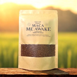 May include: A brown paper bag of "Maca Me Awake" herbal tea blend. The bag features the text "Happy Soul Organics" and ingredient information. The tea is a caffeinated blend of organic English breakfast black tea, maca root, lemon peel, and ginseng.