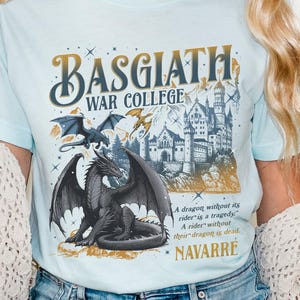 a woman wearing a t - shirt with a picture of a dragon on it