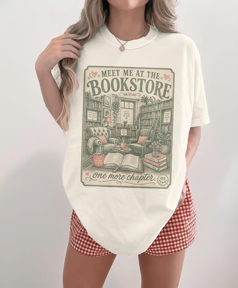 Cream t-shirt with "Meet me at the Bookstore" graphic, vintage style.