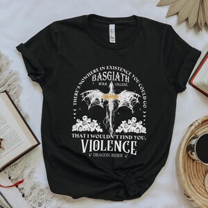 a black t - shirt with a picture of a bat on it