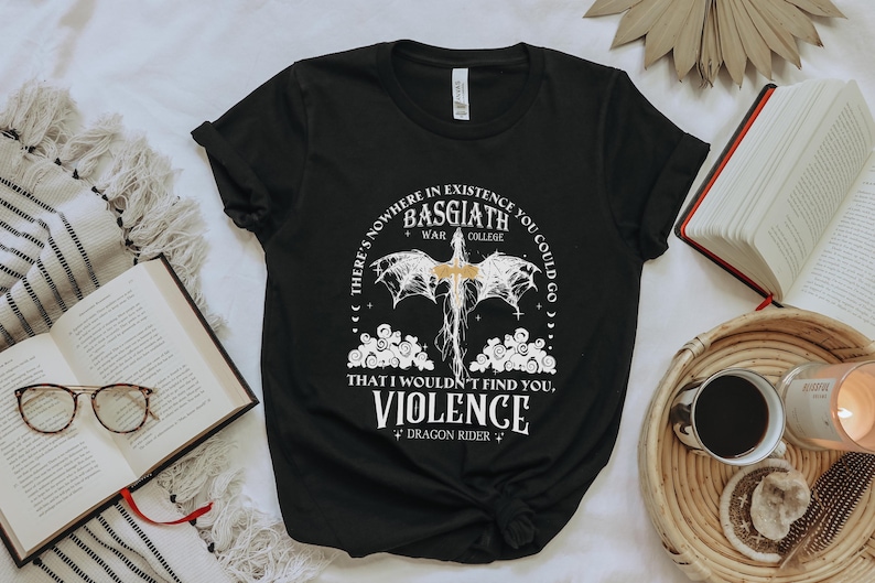 a black t - shirt with a picture of a bat on it