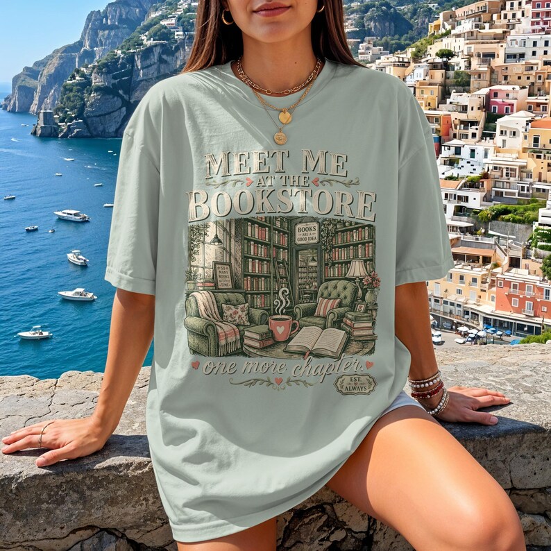 Mint green t-shirt with "Meet Me at the Bookstore" text and book-themed illustration.