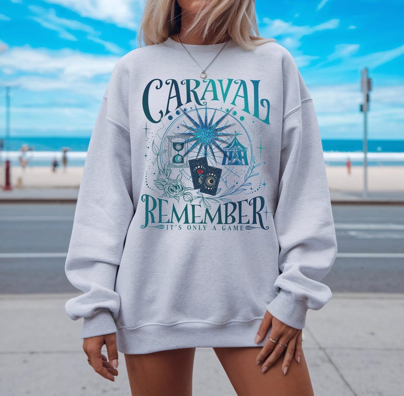 a woman wearing a sweatshirt with a ferris wheel on it
