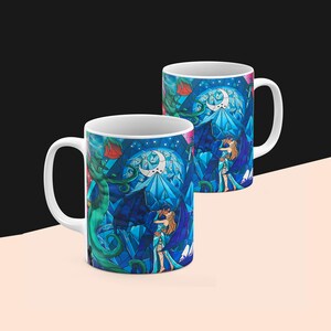 a couple of coffee mugs sitting on top of a table