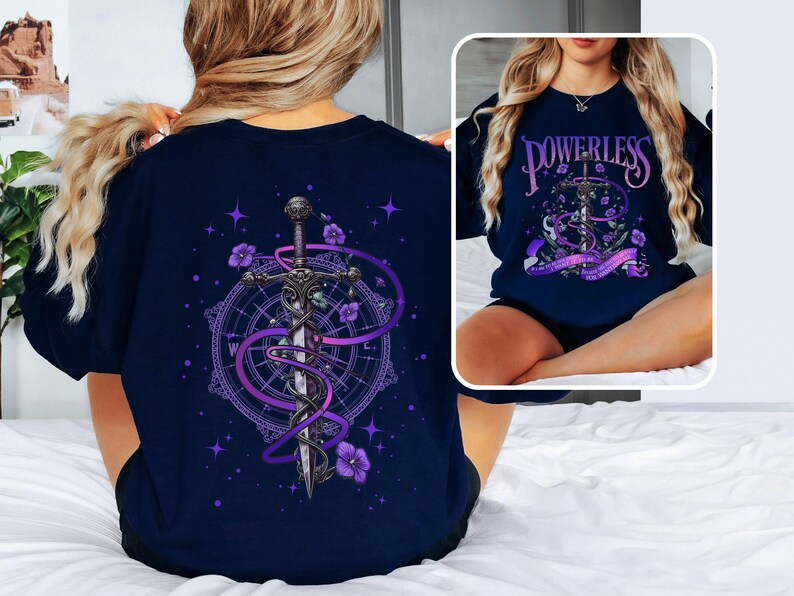 a woman sitting on a bed wearing a t - shirt