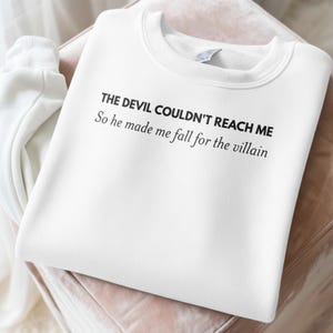 The Devil Couldn't Reach Me Sweatshirt, Fall For The Villain Sweater, Funny Quote Pullover, Trendy Graphic Apparel, Cozy Lounge Wear