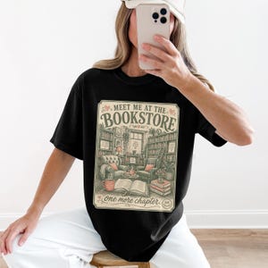 Black t-shirt with "Meet Me at the Bookstore" and library illustration.