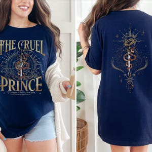 a woman wearing a t - shirt with a cross and sword on it
