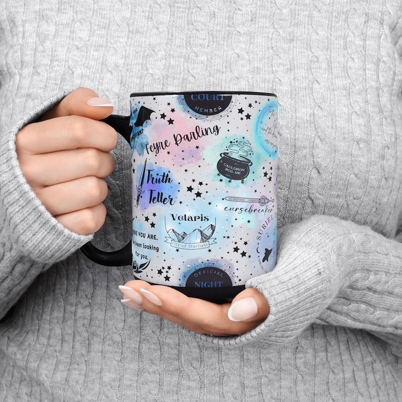 a woman holding a coffee mug in her hands