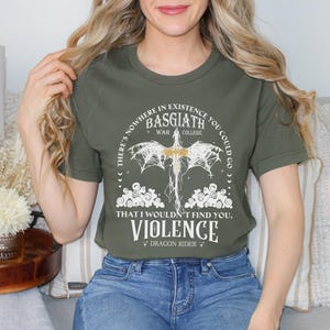 a woman wearing a t - shirt with a design on it
