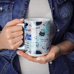 a woman holding a coffee mug in her hands
