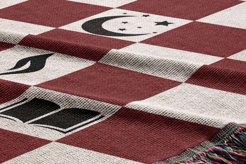 a red and white checkered table cloth with black and white symbols