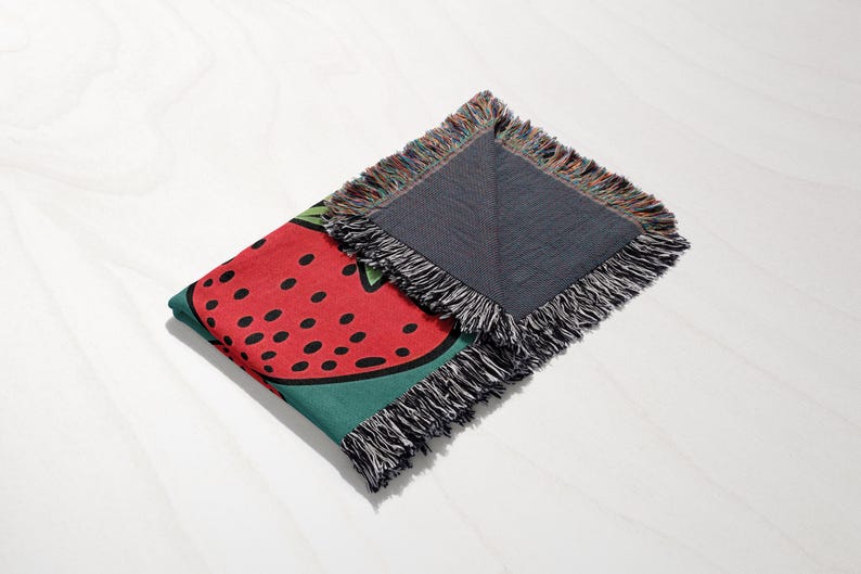 a piece of cloth with a watermelon design on it