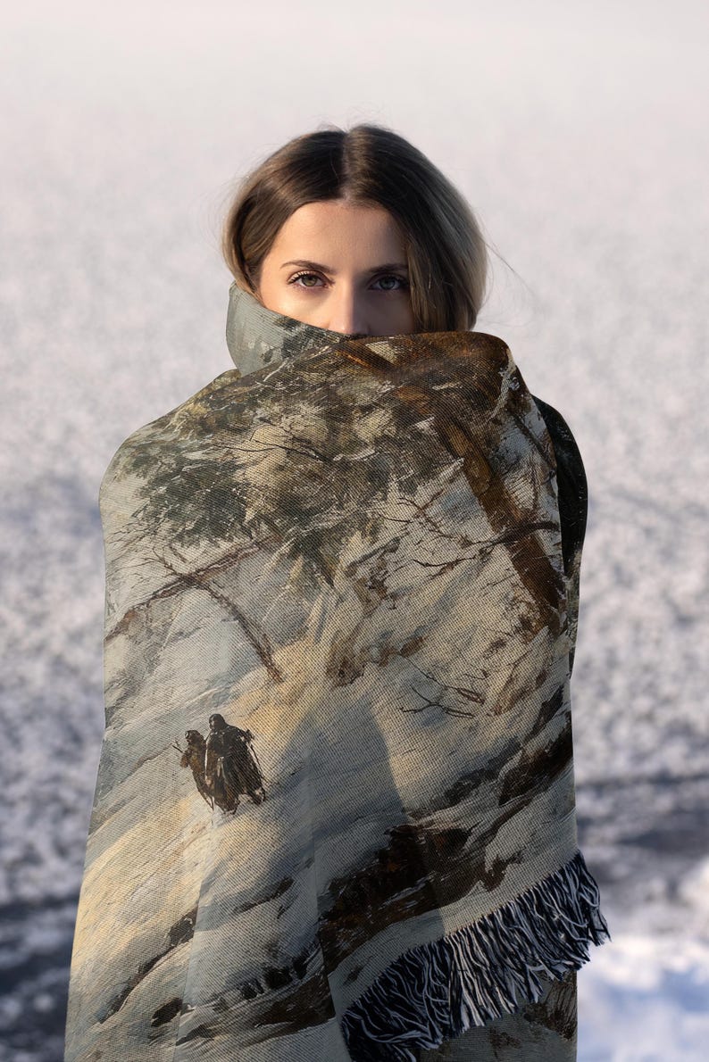 a woman is holding a blanket over her head