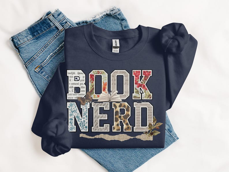Navy sweatshirt with "BOOK NERD" text design and floral patterns.