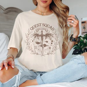 a woman sitting on a bed with her legs crossed