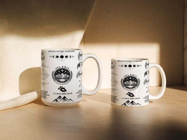 two coffee mugs sitting on a wooden table