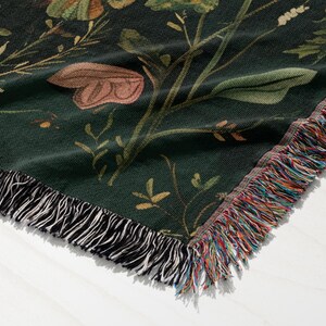 a close up of a flowered blanket on a table