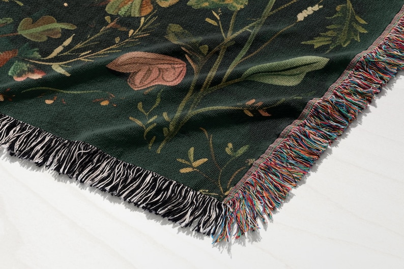 a close up of a flowered blanket on a table