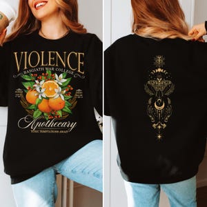a woman wearing a black shirt with oranges on it