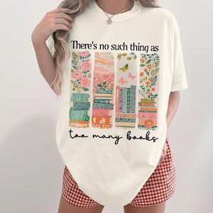 T-shirt with a floral bookshelf and the text "There's no such thing as too many books".