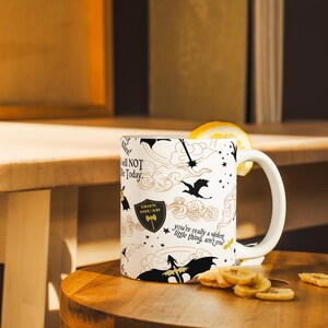a coffee mug with a lemon slice on a table