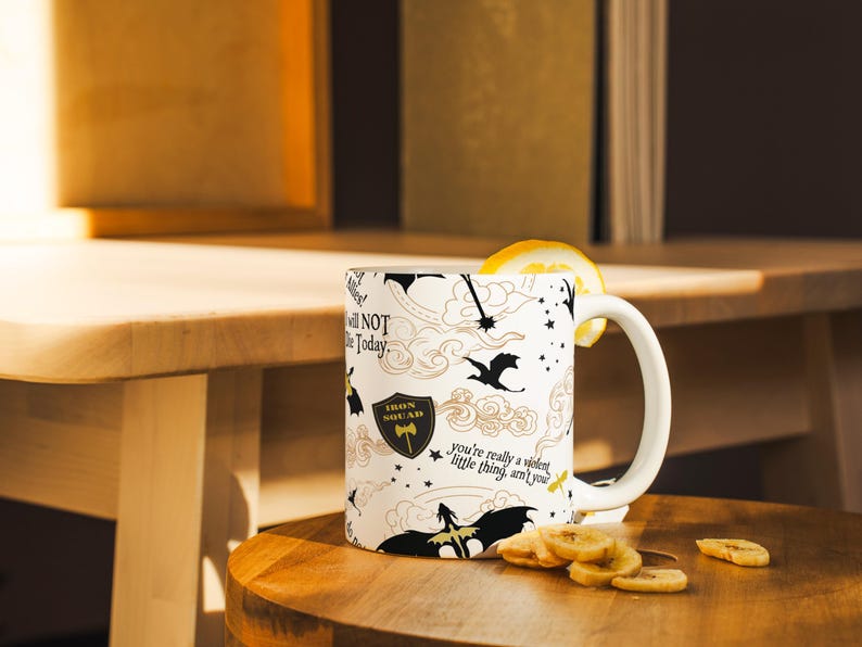 a coffee mug with a lemon slice on a table