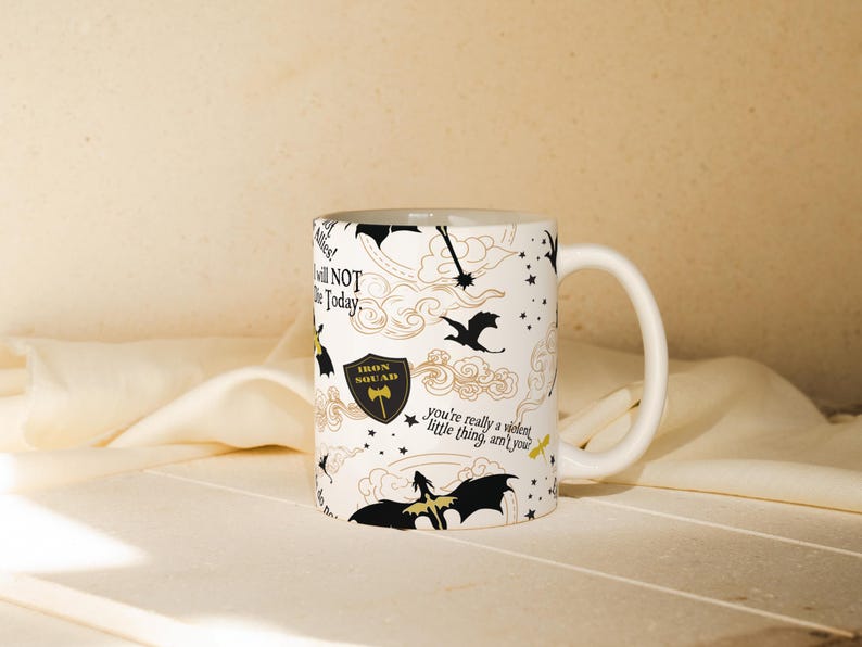 a coffee mug sitting on top of a bed