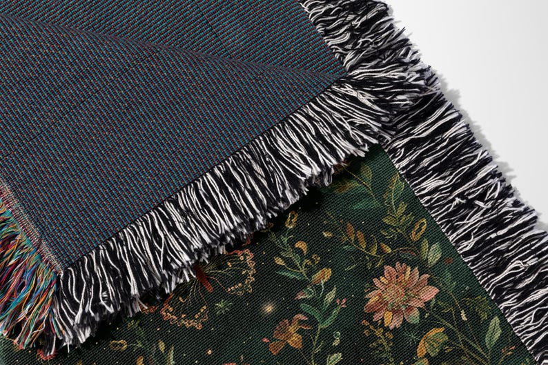 a close up of a blanket with a flower pattern