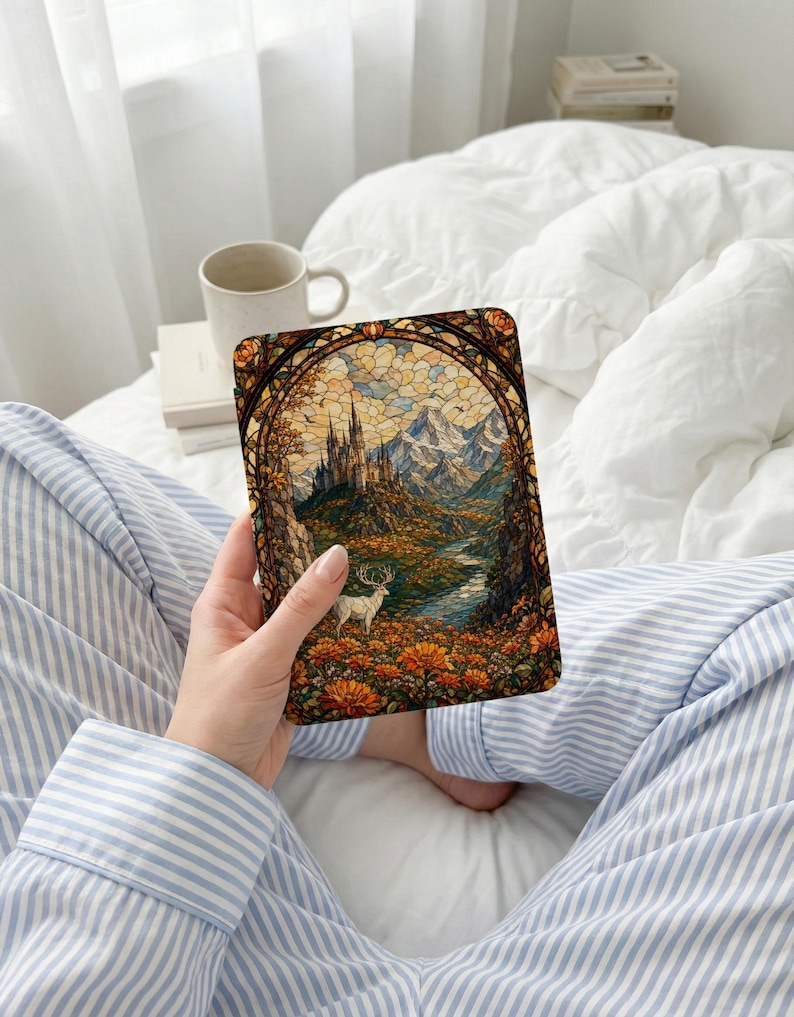 Stained glass art of a castle and deer set in a floral, mountainous landscape.