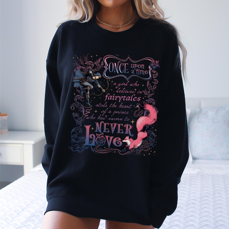 a woman wearing a black sweatshirt with a quote on it