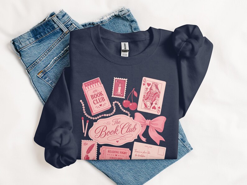 Navy sweatshirt with book club themed illustrations and text.