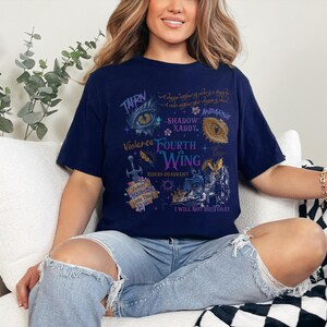 a woman sitting on a couch wearing a t - shirt
