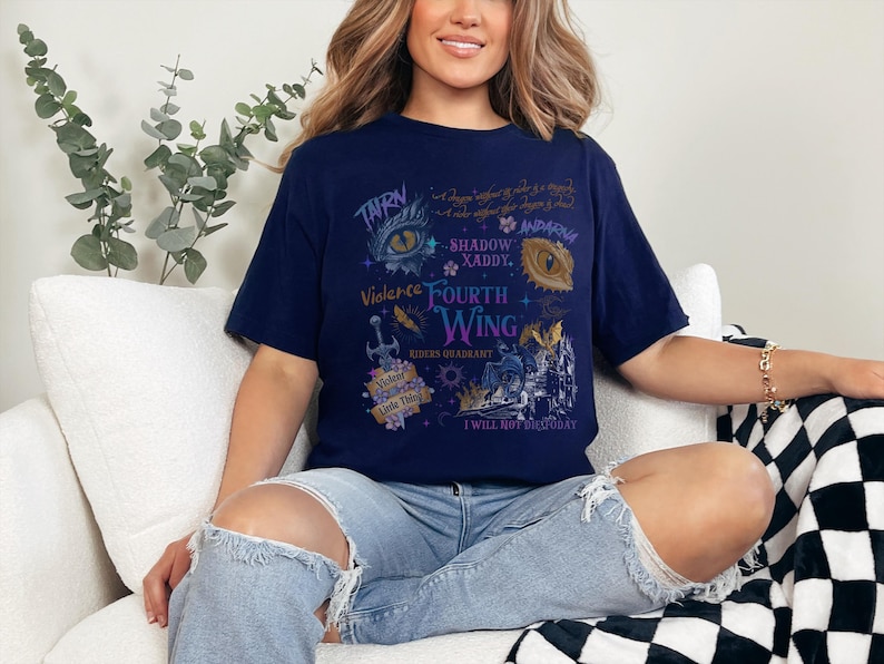 a woman sitting on a couch wearing a t - shirt